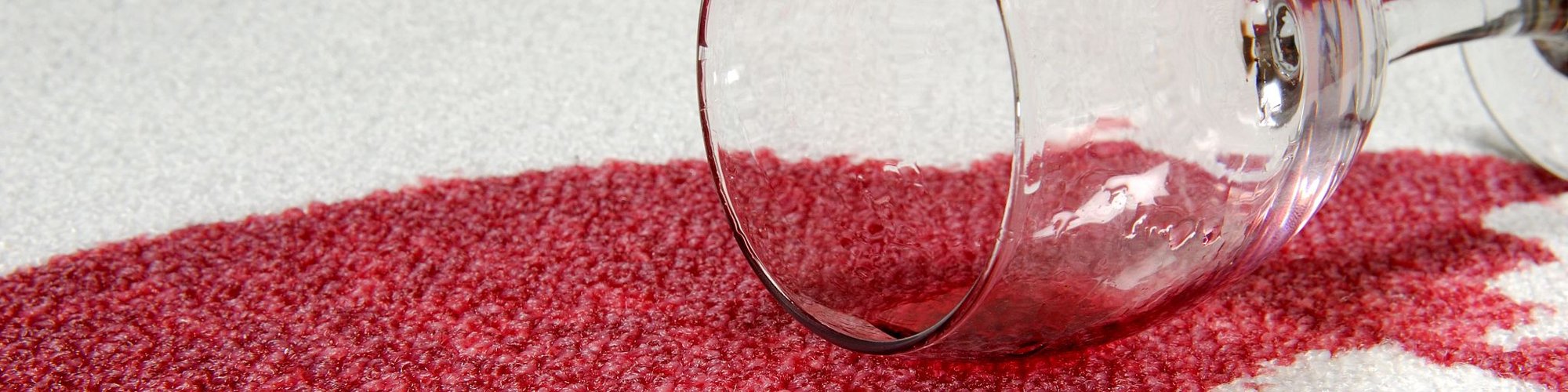 red wine spilled on white carpet